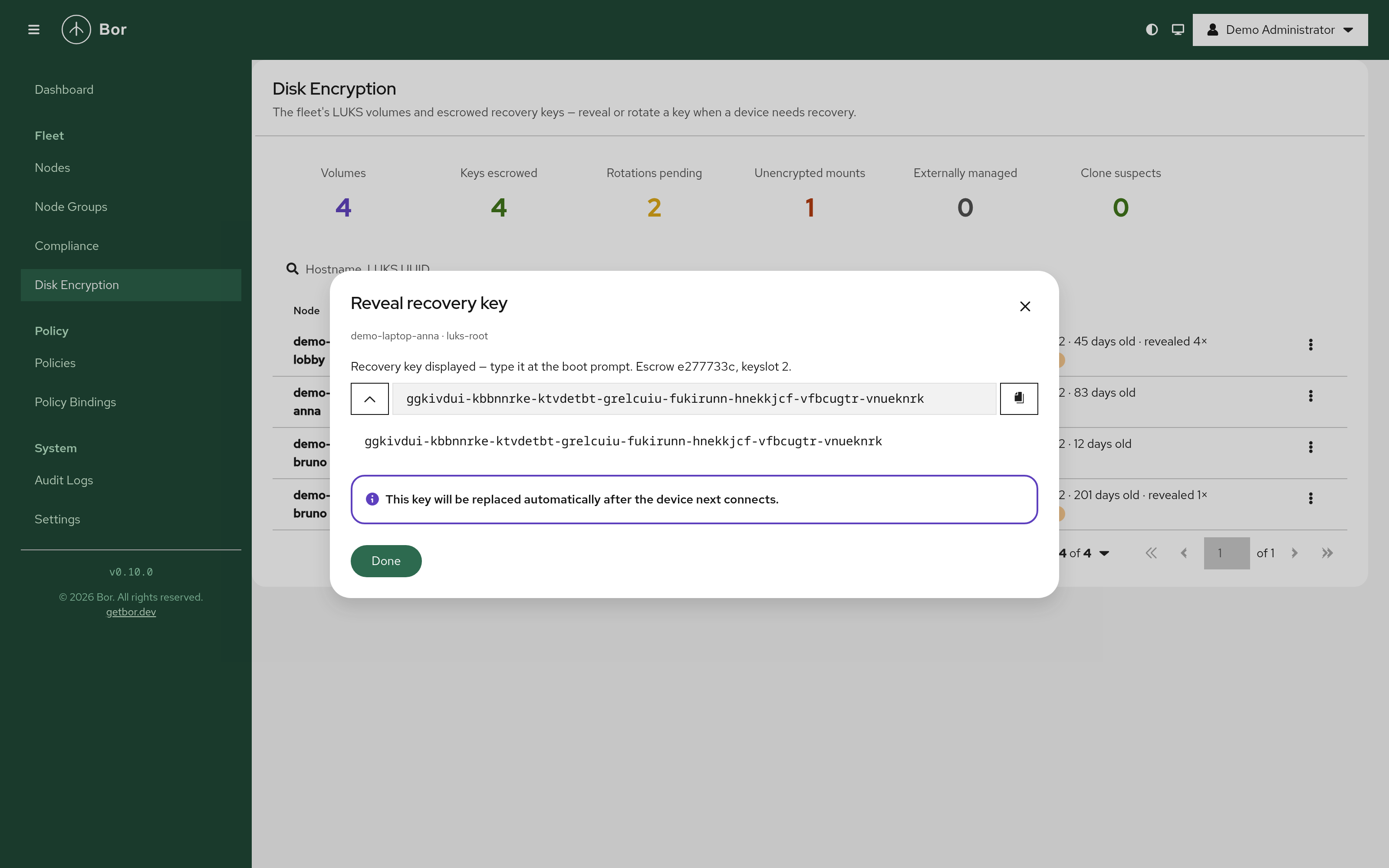 Revealing a recovery key - the 64-character key displayed after a step-up re-authentication, with the notice that it will be replaced automatically after the device next connects
